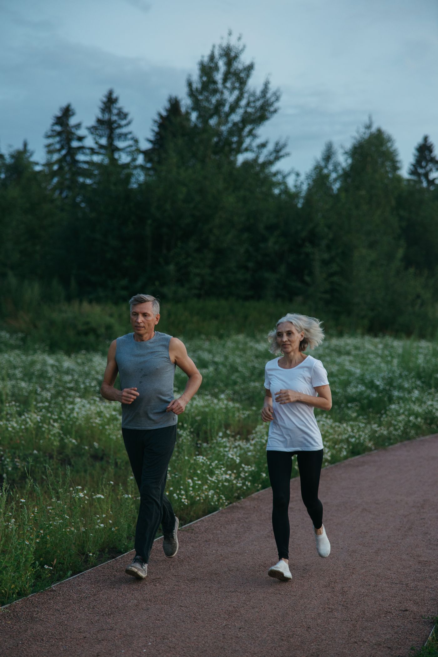 An older couple jogging together